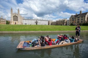 Students taking pictures of King's College of the University of Cambridge from a punt on the River Cam