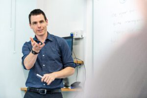 CELTA teacher at whiteboard