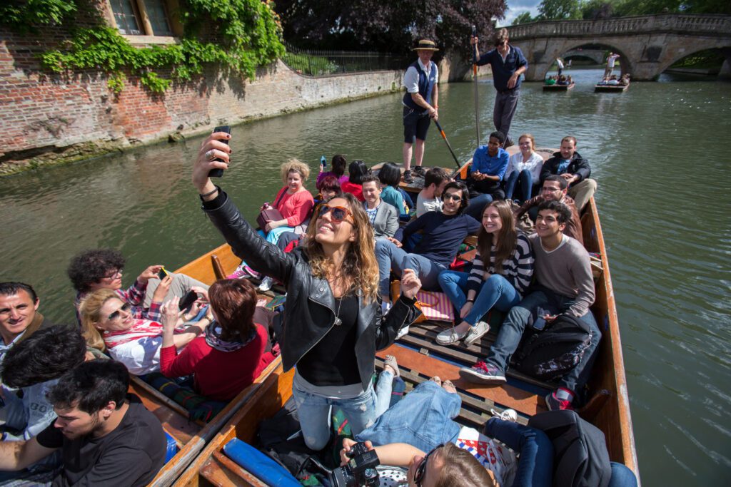 A group of students punting on the River Cam